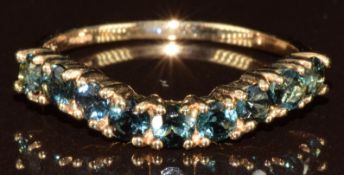 A 9ct gold ring set with blue stones, 1.7g, size N