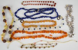 Nine beaded necklaces including amber, lapis lazuli, bakelite, pearl, glass, agate etc