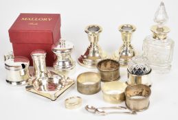 Hallmarked silver items comprising four napkin rings, pair of ashtrays, open salt and mustard with