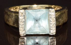 A 9ct gold ring set with topaz and diamonds, 4.2g, size P