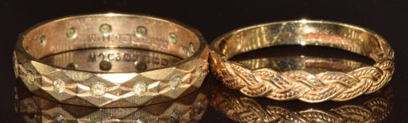 Two 9ct gold rings, one set with paste (missing stones) and the other of plaited design, 3.4g,