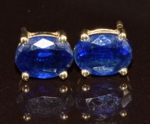 A pair of 9ct gold earrings set with oval cut spinel, 1.8g