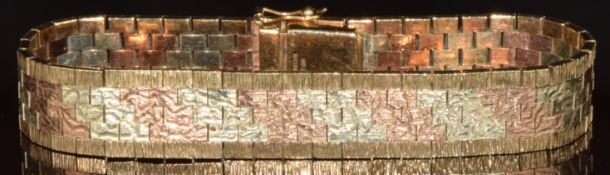 A 9ct gold bracelet made up of triple-coloured rectangular textured links, Birmingham 1971, 40.2g,