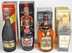 Four bottles of mixed spirits comprising Rémy Martin Champagne Cognac 70cl, Martel Cordon Rubis