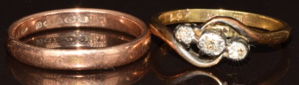 A 9ct gold wedding band / ring (2g, size O) and an 18ct gold ring set with diamonds (2.6g, size N)
