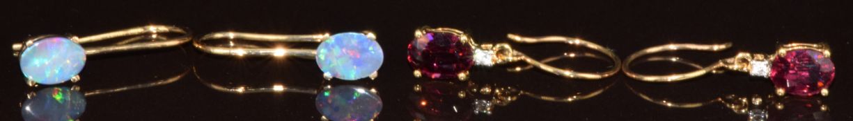 Two pairs of 9k white gold earrings, one pair set with crystal opal on ironstone and the other