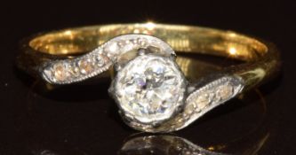 An 18ct gold ring set with an old cut diamond of approximately 0.35ct in a platinum twist setting,