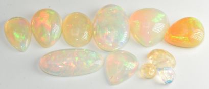 Five loose pear cut opal cabochons (8.4ct, 13.1ct, 13.2ct, 19.5ct & 5.9ct), three oval opal