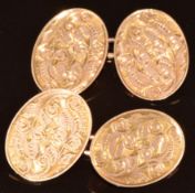 A pair of 9ct gold cufflinks with scrolling foliate decoration, 6.2g