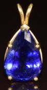 An 18k gold pendant set with a pear cut tanzanite of approximately 26.7ct, with certificate and