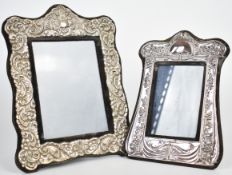 Two modern hallmarked silver photograph frames with embossed decoration and easel backs, the