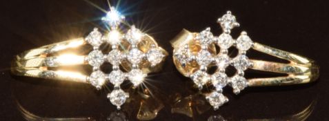 A pair of 9k gold Tomas Rae earrings set with twenty-four diamonds from the Argyle mine, total 0.