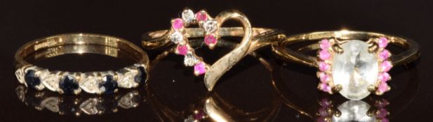 Three 9ct gold rings, one set with rubies, one sapphires and diamonds and the other aquamarine and