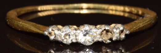 An 18ct gold ring set with two diamonds (three missing), 1.6g, size P