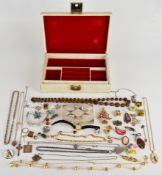 A collection of jewellery including two Butler and Wilson brooches, Victorian locket and chain,