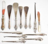 Nine hallmarked silver handled dressing table items including shoe horns and button hooks, further