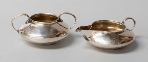 A George V Silver Cream-Jug and Sugar-Bowl, by Liberty and Co., Birmingham, 1910, each compressed