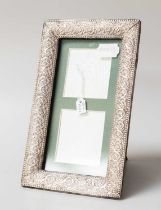 A George V Silver-Mounted Photograph-Frame, Birmingham, 1913, oblong, the sides stamped with foliage