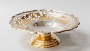 A George V Silver-Gilt Pedestal-Dish, by Charles S. Green and Co. Ltd., Birmingham, 1922, shaped