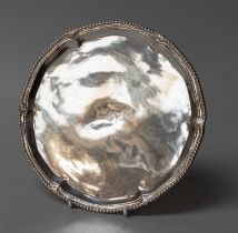 A George III Silver Waiter, by John Carter, London, 1774, shaped circular and on three claw and ball