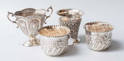 Four Assorted Silver Items, including a two-handled tapering cup; a pair of bowls with spiral-fluted