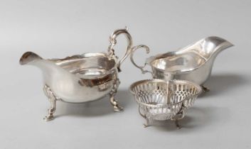 Three Assorted Silver Items, comprising two George V sauceboats, each in the George III style and