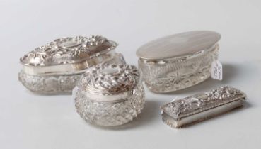Three Silver Mounted Cut-Glass Dressing-Table Boxes, each variously formed, one with engine-turned