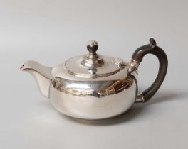 An Edward VII Silver Teapot, by James Parkes, London, 1905, compressed circular and on collet