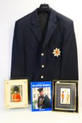 A blazer bearing Coldstream Guards badge, photographic image of a guard,