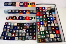 A large quantity of individually boxed collector thimbles, various makers.