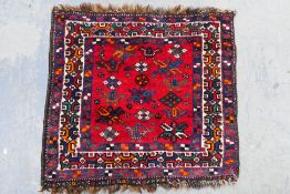 A small kilim prayer mat or rug, approximately 65 cm x 70 cm.