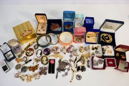 A good collection of costume jewellery to include rings, necklaces, bracelet, brooches,