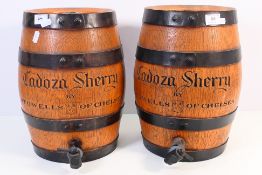 A pair of Cadoza Sherry barrels By Stowells Of Chelsea, approximately 34 cm (h). [2].
