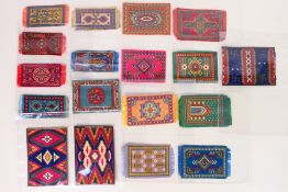 A collection of vintage cigarette felts / blankets, rug designs, various sizes,