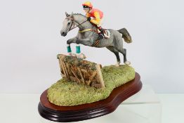 A Border Fine Arts model of horse racing interest entitled The Last Hurdle depicting a horse and