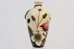 Moorcroft - A Moorcroft Pottery vase decorated in the Bramble Revisited pattern,