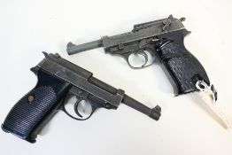 Two German Walther P38 Replica Pistols Two non-firing replicas of the iconic Walther P38 pistol,