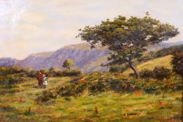 A late 19th century oil on canvas landscape scene depicting a lady and young girl walking in a