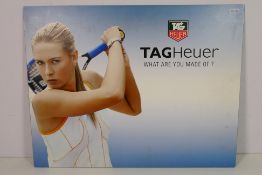 A Tag Heuer double sided advertising display featuring Juan Pablo Montoya and Maria Sharapova,