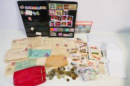 A mixed lot to include stamps, a small quantity of coins,