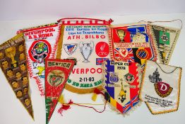 A collection of football pennants, predominantly relating to Liverpool Football Club,