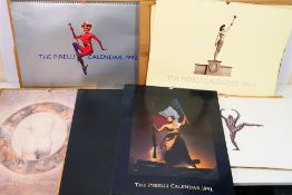 A collection of vintage Pirelli calendars, 1980's and 1990's, some in original packaging.