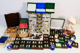 A large quantity of collector thimbles, display stands and similar, part boxed.