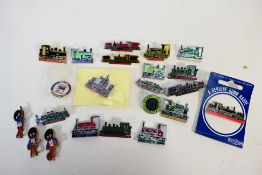 A collection of enamel pin badges,