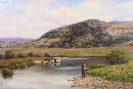 An early 20th century oil on canvas landscape scene depicting a fisherman at the shores of a river