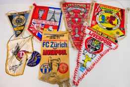 A collection of football pennants, predominantly relating to Liverpool Football Club,
