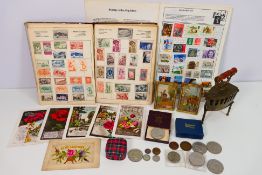 Lot to include two stamp albums, a small quantity of postcards,