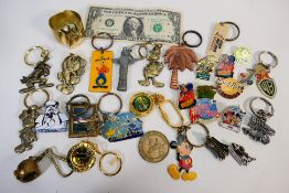 Disney, Star Wars - A collection of Disney, American attractions metal key rings and pin badges.
