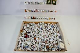 A large quantity of collector thimbles, predominantly ceramic to include Coalport, Royal Worcester,