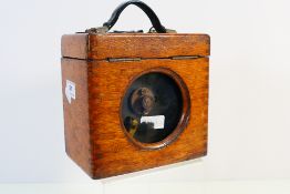 A vintage Coulet Excelsior pigeon racing clock contained in oak case.